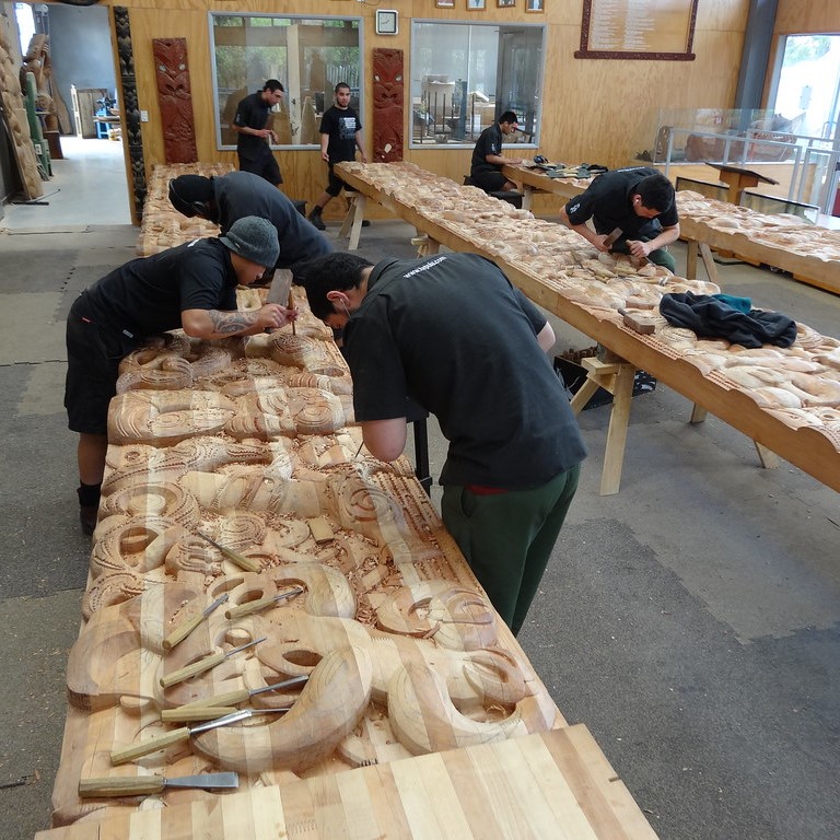 Whakarewarewa Maori carving school where young men learn traditional carving techniques and styles in Rotorua
